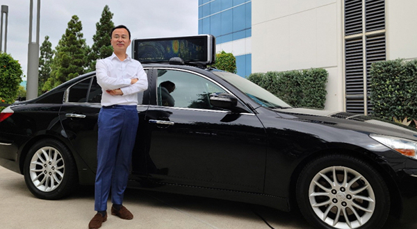 Motov CEO Lim Woo-hyuk pictured with ‘Motov Edge AI Device’ car. [Photo provided by Motov]