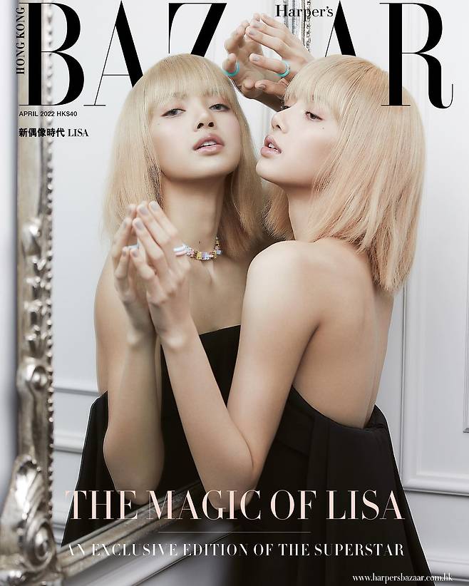 BLACKPINK Lisa has emanated a chic and mysterious charm in the Hong Kong magazine pictorial.Lisa appeared as a blonde haircut in the April issue of Harpers Bazaar Hong Kong, which was released on the 25th.In the public cover image, Lisa posed in front of the mirror in a black dress with exposed shoulders and backs, creating a dreamy yet sexy atmosphere with a cold, brainwashing look.In other photos, white tops and black leather skirts have raised the chic charm to the fullest, and a pink dress has created a Hwasa Spring atmosphere.BLACKPINK Lisa recently attended 2022 S/S Paris Fashion Week and arrived in Thailand on the 22nd.
