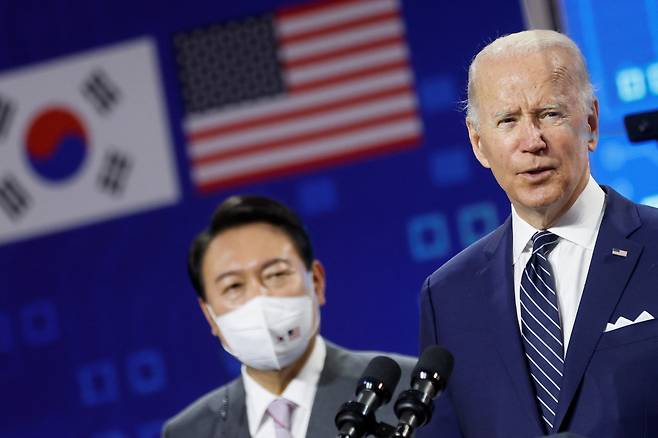 South Korean President Yoon Suk-yeol looks on as U.S. President Joe Biden delivers remarks during a visit to a semiconductor factory at the Samsung Electronics Pyeongtaek Campus in Pyeongtaek on Friday. (Reuters)