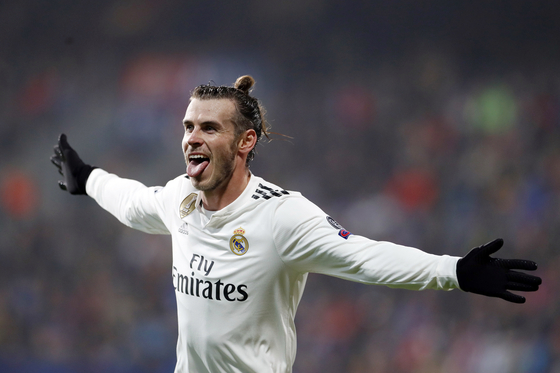 FILE - Real Madrid midfielder Gareth Bale celebrates after scoring his side's fourth goal during the Champions League group G soccer match between Real Madrid and Viktoria Plzen at the Doosan arena in Pilsen, Czech Republic, on Nov. 7, 2018. Los Angeles FC has reached a deal with Bale to move to Major League Soccer after his departure from Real Madrid, a person close to the deal told The Associated Press. The person spoke Saturday, June 25, 2022, on condition of anonymity because the details of the 12-month deal are still being finalized. (AP Photo/Petr David Josek, File) FILE PHOTO  〈저작권자(c) 연합뉴스, 무단 전재-재배포 금지〉
