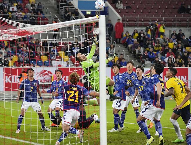 Japan's goalkeeper Daniel Schmidt saves the ball during the international friendly soccer match between Japan and Ecuador as part of the Kirin Challenge Cup in Duesseldorf, Germany, Tuesday, Sept. 27, 2022. (AP Photo/Martin Meissner)
