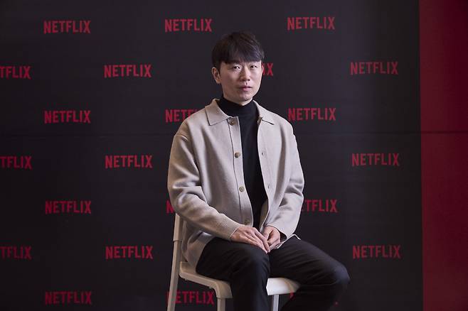 Jang Ho-gi, creator of "Physical: 100," poses for photos before a press conference at Community House Masil in Myeong-dong, central Seoul, Tuesday. (Netflix)