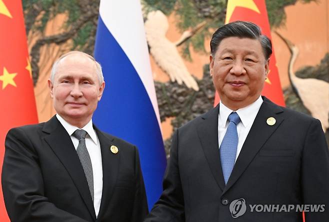 푸틴 러시아 대통령과 시진핑 중국 국가주석 [타스=연합뉴스 자료사진. 재판매 및 DB 금지]