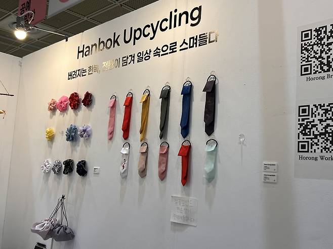Fashion items made from upcycled hanbok fabric are displayed at the Craft Trend Fair on Dec. 13. (Park Jun-hee/The Korea Herald)