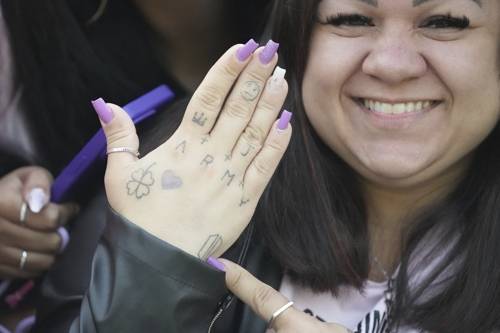 South Korea Music BTS Jimin Jung Kook Daiane Matos from Brazil, 37, shows her hand as she waits for arrival of K-pop band BTS members Jimin and Jung Kook in Yeoncheon, South Korea, Wednesday, June 11, 2025. (AP Photo/Lee Jin-man) <Copyright (c) Yonhap News Agency prohibits its content from being redistributed or reprinted without consent, and forbids the content from being learned and used by artificial intelligence systems.>