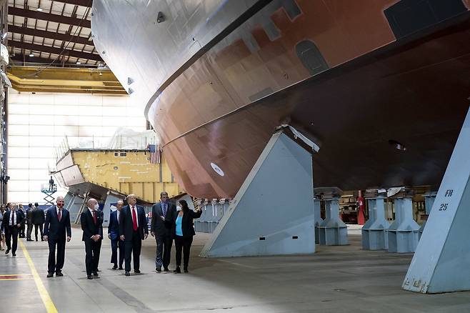 In this file photo, US President Donald Trump (third from right) tours the Fincantieri Marinette Marine Corporation shipyard in Marinette, Wisconsin, on June 25, 2020. (US Department of Defense)