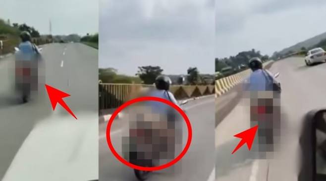 지난 10일(현지시간) 인도 마하라슈트라주(州)에 있는 나그푸르-자발푸르 고속도로에서 아내의 시신을 오토바이에 단단히 묶은 채 달리던 남성. 엑스 영상 캡처