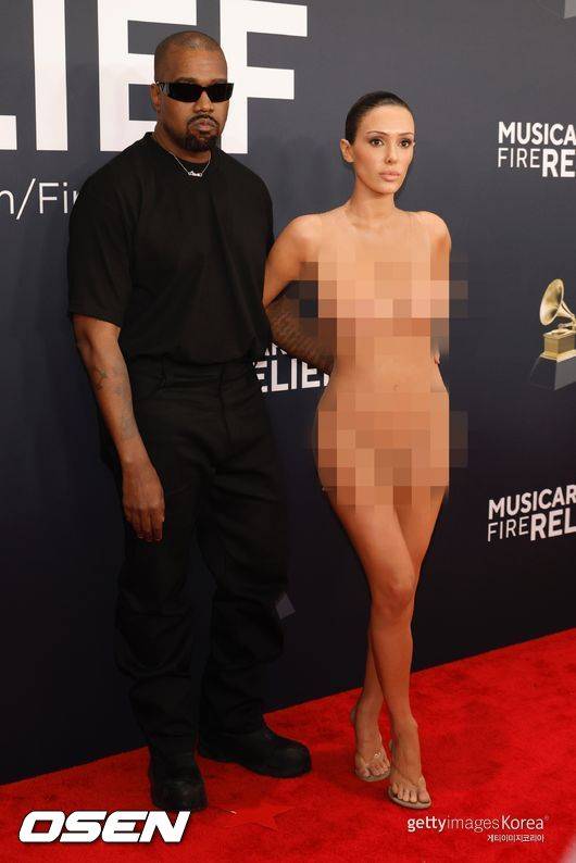 LOS ANGELES, CALIFORNIA - FEBRUARY 02: (FOR EDITORIAL USE ONLY) (EDITOR'S NOTE: Image contains nudity.) (L-R) Kanye West and Bianca Censori attend the 67th GRAMMY Awards on February 02, 2025 in Los Angeles, California. (Photo by Frazer Harrison/Getty Images)