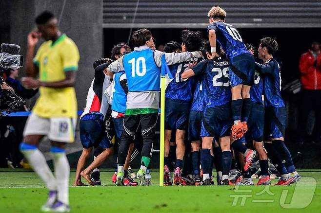 브라질을 꺾은 일본 축구대표팀 ⓒ AFP=뉴스1