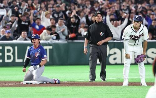 손가락 골절 부상을 안고도 과감한 슬라이딩으로 3루에서 세이프 되는 대만 대표팀 주장 천제셴. 사진=-연합뉴스