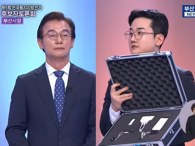 26일 열린 부산시장 후보자 토론회에서 개혁신당 정이한 후보가 거짓말 탐지기를 꺼내들며, 민주당 전재수 후보를 향해 의혹을 털 의향이 있냐고 묻고 있다. /사진=부산MBC뉴스 유튜브 캡처