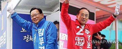 김부겸·추경호 대구시장 후보 (대구=연합뉴스) 김현태 윤관식 기자 = 더불어민주당 김부겸 대구시장 후보(왼쪽)와 국민의힘 추경호 대구시장 후보가 21일 대구 범어네거리와 반월당사거리에서 출근길 인사를 하고 있다. 2026.5.21
mtkht@yna.co.kr
psik@yna.co.kr