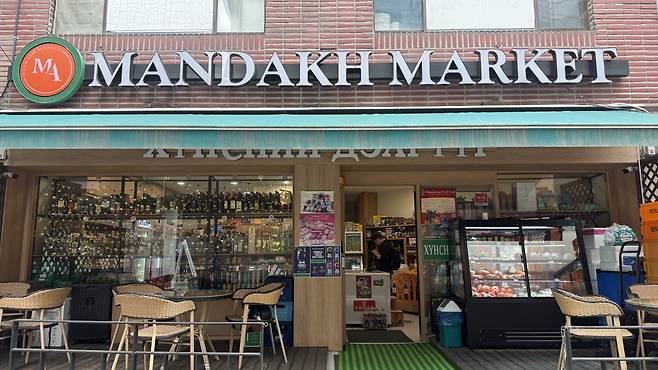 Tables and chairs are seen set up outside Mandakh Market. WOO JI-WON