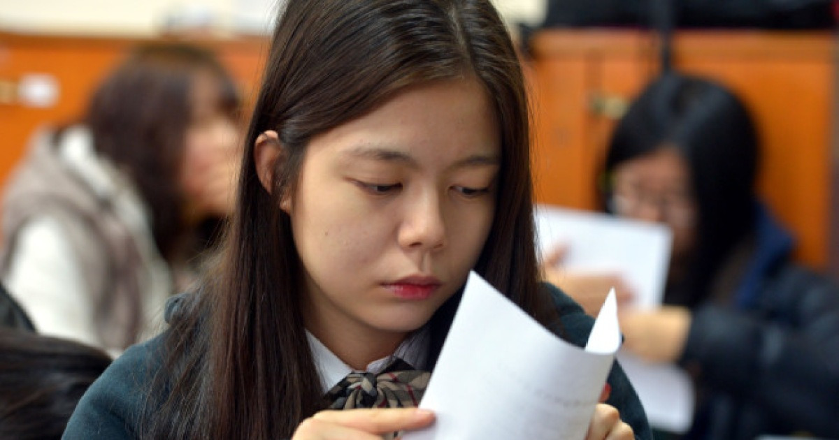 Dispute escalates over college exam questions