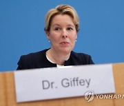 GERMANY MINISTER GIFFEY DOCTORATE