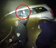 [영상] 졸다 강물로 추락한 운전자..도끼로 창문 깨부순 경찰