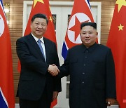시진핑 '총서기', 김정은 '총비서'에 축전