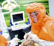 Virus Outbreak Germany Dentist