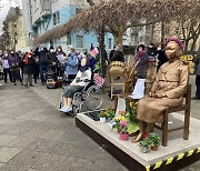 Berliners celebrate International Women's Day in front of comfort women statue