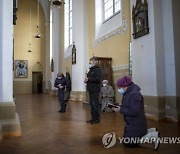 Virus Outbreak Lithuania Sunday Mass