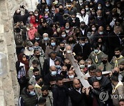 Virus Outbreak Israel Palestinians Holy Week