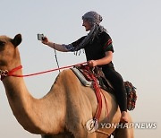 UAE FEMALE CAMEL RIDING SCHOOL