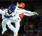 Taekwondo practitioners kick for gold at Games