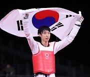 Taekwondo practitioner Jang Jun wins bronze in men's 58 kilogram