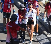 Korean marathon runners beat the heat to finish in tough conditions