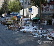 MIDEAST PALESTINIANS HEBRON GARBAGE