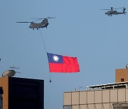 China displays massive show of force in Taiwan's skies, says it will "crush" attempts at independence