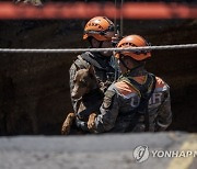 APTOPIX Guatemala Sinkhole