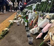 Flowers and mourning postings adorn the deadly Itaewon alley of crowd crush horror