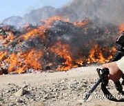 AFGHANISTAN EXPIRED FOOD ITEMS BURNING