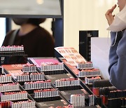 Masks off, lipstick on, sales up, department stores argue