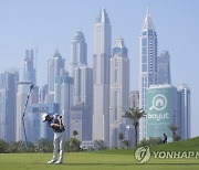 APTOPIX Dubai Desert Classic Golf