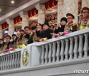 북한, 건군절 75주년 '야간 열병식' 개최…경례 받는 김정은