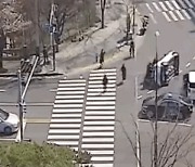 Passersby flip car on its side to rescue driver