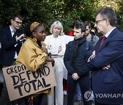 AVAAZ Action outside Credit Agricole Annual General Meeting in Paris