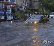 CORRECTION Pakistan Monsoon Rains