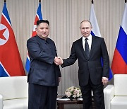 Kim Jong-un meets Vladimir Putin at Russian spaceport after four-year gap