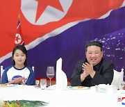 Kim Jong-un praises North's 'space guard' at celebration of spy satellite launch