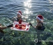 SWITZERLAND SWIM SANTA LAKE CHRISTMAS