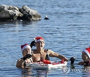 SWITZERLAND SWIM SANTA LAKE CHRISTMAS