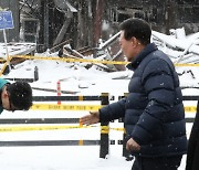 尹에 90° 굽힌 한동훈…서천 화재현장서 갈등 봉합 제스처