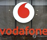 Britain Vodafone Swisscom