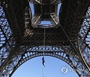 APTOPIX France Eiffel Tower Rope Climbing