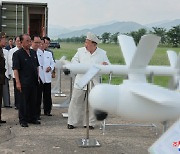 North unveils new suicide drones as leader Kim aims to accelerate production