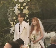 HyunA and Yong Jun-hyung walk down the aisle in matching outfits