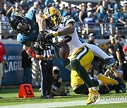 APTOPIX Packers Jaguars Football